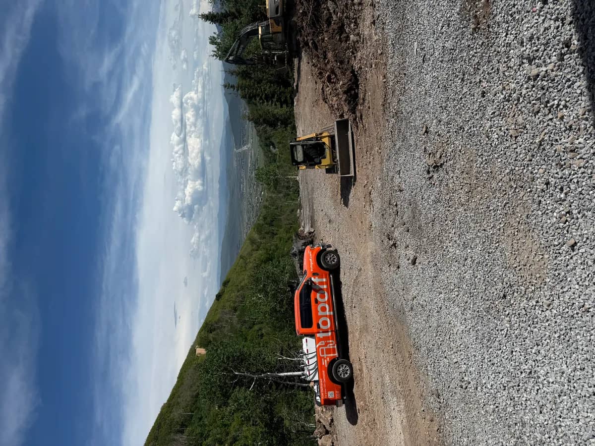 Red dyed diesel fuel delivery to skid steer at construction site in Utah County