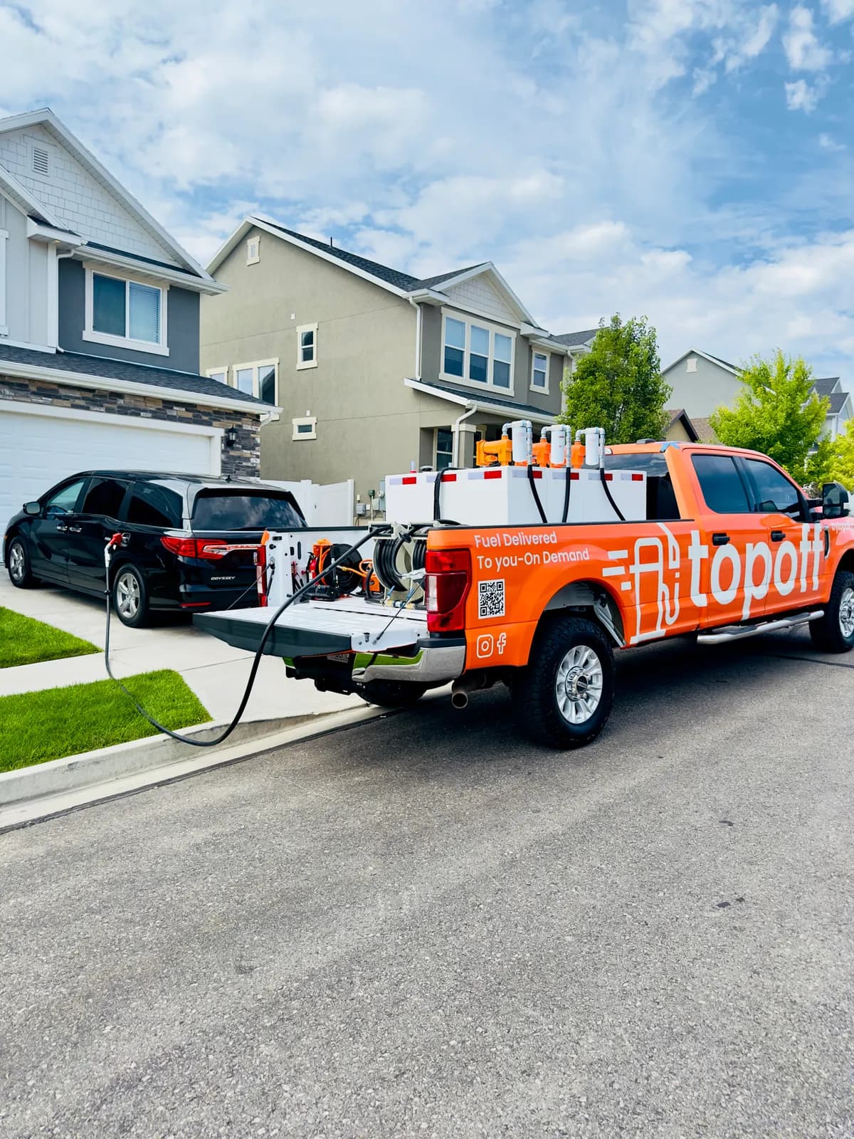 TopOff fuel delivery truck fueling a vehicle in a Vineyard, Utah driveway